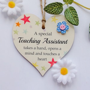 A Special Teaching Assistant Takes A Hand Wooden Gift Heart