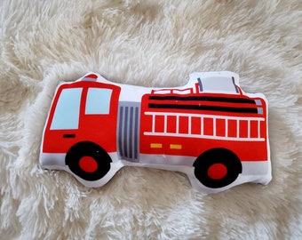 May include: Red fire truck shaped plush toy with black wheels and a white and black ladder.