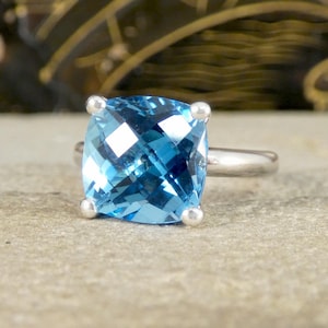 May include: A set of three ceramic mugs with a speckled, matte finish. The mugs are in shades of cream, light gray, and dark gray. Each mug has a simple, minimalist design, perfect for coffee or tea.