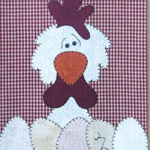 May include: A white and brown patchwork chicken with a red beak and a red comb. The chicken is surrounded by white eggs with brown spots.