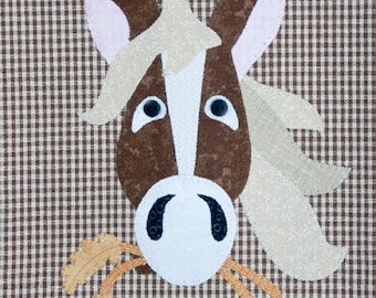 Horse is a pattern from The Wooden Bear Co. It's a hand or machine applique pattern that is easy and suitable for a variety of applications.