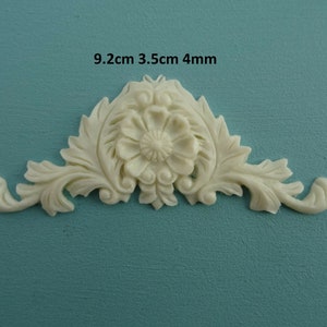 May include: White decorative trim with a floral design, measuring 9.2 inches by 3.5 inches by 0.4 inches.