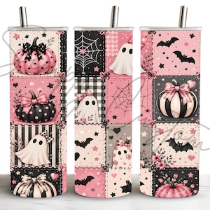 May include: Three cylindrical tumblers with metal straws featuring a patchwork design of pink and black Halloween motifs. The pattern includes pumpkins with bows, ghosts, spiderwebs, bats, and stars arranged in a grid of square panels.