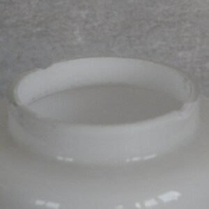 May include: White glass lampshade with a rounded top and a smooth, glossy finish.