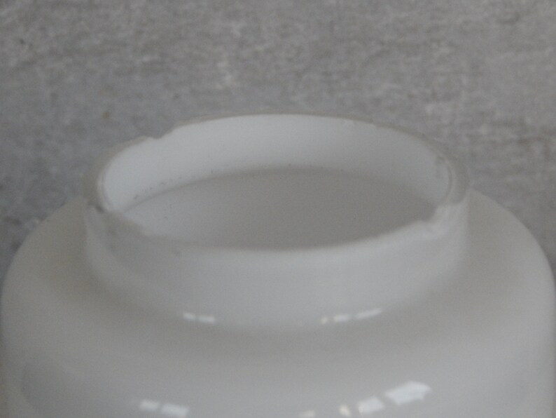 May include: White glass lampshade with a rounded top and a smooth, glossy finish.