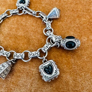 May include: A rustic wooden sign with the text "Welcome to our home" in white lettering. The sign features a distressed finish and a simple, inviting design, perfect for entryway decor.