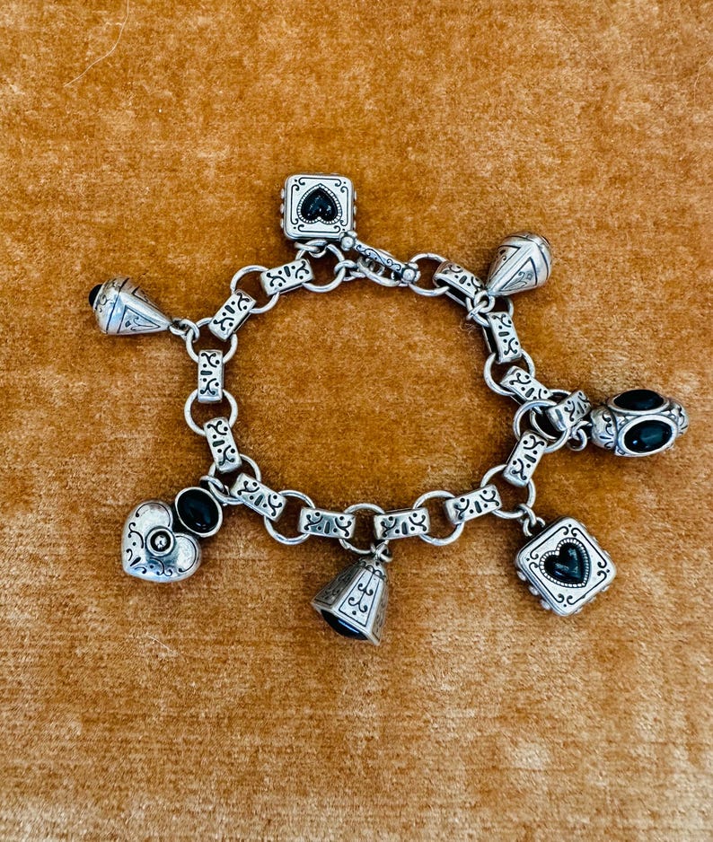 May include: A set of three ceramic mugs with a speckled, matte finish. The mugs are in shades of cream, light gray, and dark gray. Each mug has a simple, minimalist design and a rounded handle.