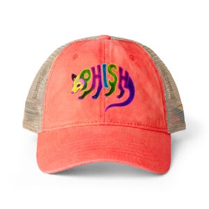 May include: A coral-coloured baseball cap with a tan mesh back. The front features an embroidered graphic of an opossum shaped into the letters of the word PHISH, rendered in vibrant gradient colours including green, blue, yellow, and purple.