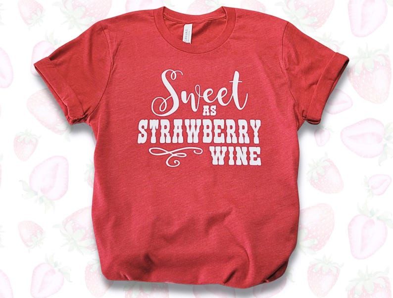 May include: Red t-shirt with white text that reads "Sweet as Strawberry Wine".