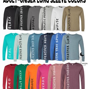May include: A selection of long-sleeve shirts in various colors, including black, teal, red, kelly green, orange, berry, heather dusty blue, heather deep teal, asphalt, heather navy, athletic heather, heather mauve, hthr true royal, heather maroon, heather slate, and heather olive. The shirts are arranged in two rows of eight.