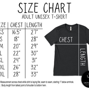 May include: Size chart for adult unisex t-shirts. The chart shows sizes XS through 3XL with corresponding chest and length measurements in inches. The chart also includes a diagram of a t-shirt with the chest and length measurements labeled.