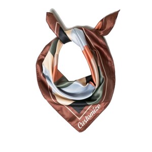 May include: A brown, blue, green, and cream patterned silk bandana with the word "Customize" embroidered on the bottom corner.