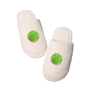 May include: A pair of white fuzzy slippers with a green tennis ball embroidered on each slipper.