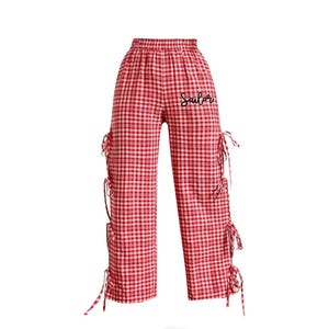May include: Red and white checkered pants with a black "Sailor" embroidery and side ties.