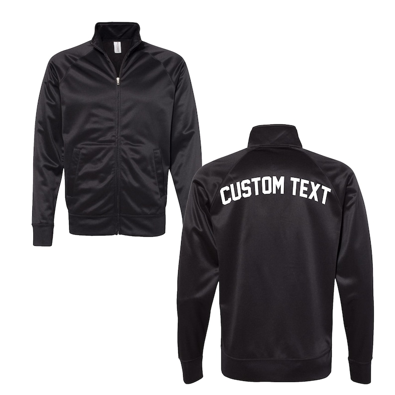 May include: Black zippered jacket with a white "CUSTOM TEXT" on the back.