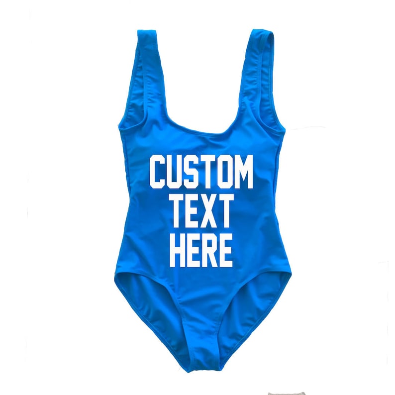 May include: A bright blue swimsuit with white text that says "CUSTOM TEXT HERE".