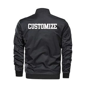 May include: A black bomber jacket with a white "CUSTOMIZE" text on the back.