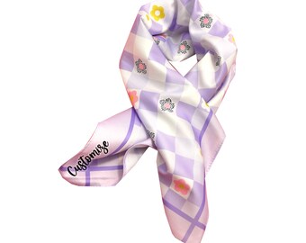 May include: A purple and white checkered silk scarf with a floral pattern and the word "Customise" printed on it.
