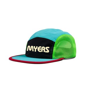 May include: A teal, black, and green cap with the word "MYERS" in a cream color. The cap has a red brim and a mesh side panel. The cap is designed for outdoor activities.