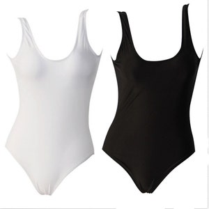 May include: Two sleeveless one-piece swimsuits, one white and one black.