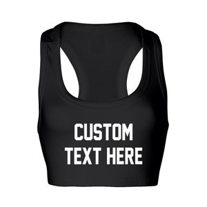 May include: Black sports bra with white text that says "CUSTOM TEXT HERE".