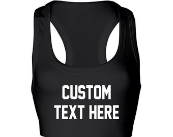 May include: Black sports bra with white text that says "CUSTOM TEXT HERE".