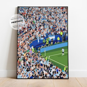 May include: A vertical digital art print featuring a high-angle view of a crowded soccer stadium with fans wearing light blue and white jerseys. A single player in a light blue and white kit stands on the green grass near the corner flag.