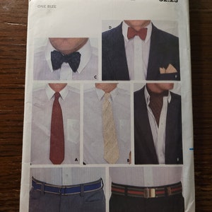 May include: A vintage sewing pattern for a men's shirt and pants. The pattern is from Butterick and has the number 3533 on it. The pattern includes instructions for making a bow tie, a tie, and a scarf.