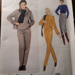 May include: Vogue American Designer sewing pattern number 2222 by Leo Narducci. The pattern features two women's outfits. One outfit is a gray jacket and pants. The other outfit is a yellow jacket and pants.
