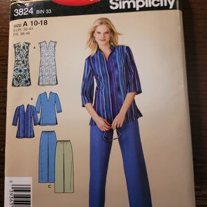 May include: A sewing pattern for a women's top and pants. The pattern includes three different views: a tunic top with a V-neck, a long-sleeved shirt with a V-neck, and a pair of pants. The pattern is for sizes 10-18. The pattern is from Simplicity and the pattern number is 3824.
