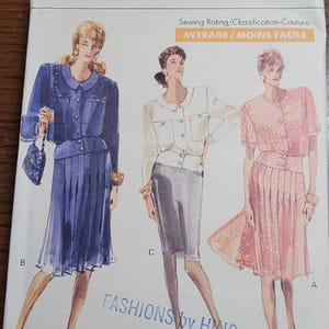 May include: Vogue Patterns sewing pattern featuring three fashion designs. The pattern includes a blue suit, a white jacket and gray skirt, and a pink dress. The pattern is rated as average difficulty.