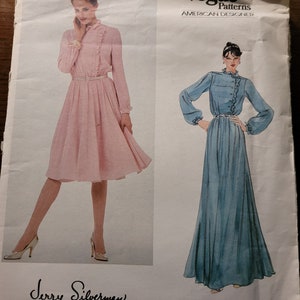 May include: Vogue Patterns American Designer sewing pattern for a dress by Jerry Silverman. The pattern shows two versions of the dress, one in pink and one in blue. The pattern number is 2782.