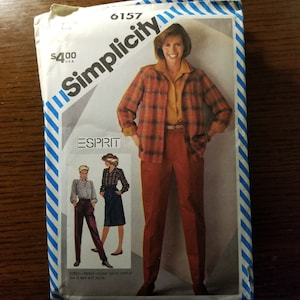 May include: Simplicity sewing pattern number 6157 for a plaid shirt and pants. The pattern includes a special chart on how to work with plaids. The pattern is for sizes 8 to 18.