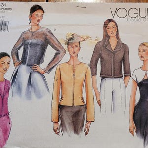 May include: Vogue Basic Design sewing pattern featuring illustrations of women's jackets and dresses. The pattern includes a variety of styles, including a pink suit, a tan jacket, and a black dress. The pattern number is 2431.