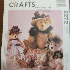 May include: A sewing pattern for making three teddy bears. The pattern is called "Little City Bears & Co." and is designed by Maureen Hills. The pattern includes instructions for making a teddy bear wearing a dress, a teddy bear wearing a fur stole, and a teddy bear wearing a leopard print coat. The pattern is from McCall's Crafts and is number 2272.