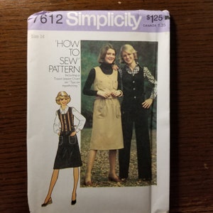 May include: A vintage Simplicity sewing pattern for a skirt and vest. The pattern is for size 14 and includes a tissue lesson chart on topstitching. The pattern cover features two women wearing the garments, one in a brown skirt and vest, and the other in a black skirt and vest.