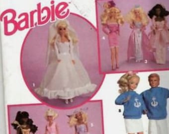 May include: Simplicity Barbie pattern featuring multiple Barbie dolls in various outfits, including a wedding dress, pink dresses, and casual wear. The pattern includes the text "Barbie" in pink.