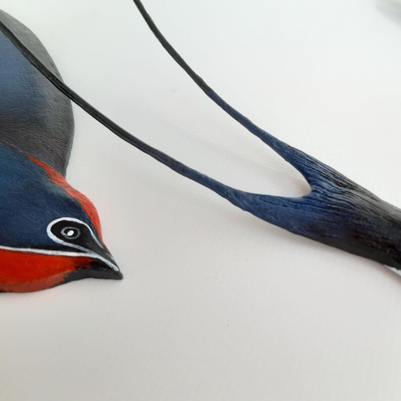 A Couple of Minimalist Painted Wooden and Metal Barn Swallows in Flying