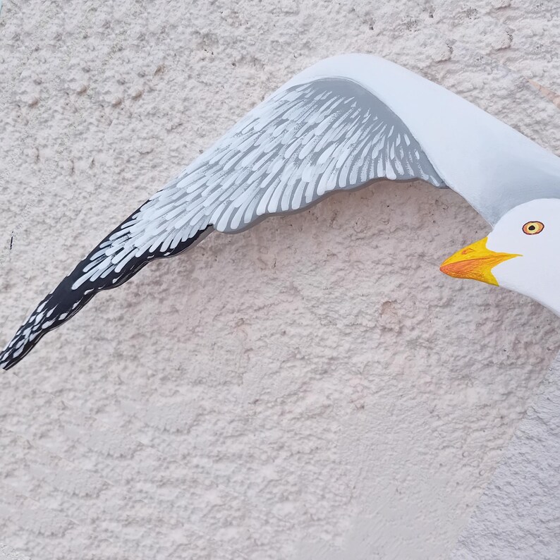 Hand-painted wooden seagull close-up – detailed view of craftsmanship and brushwork