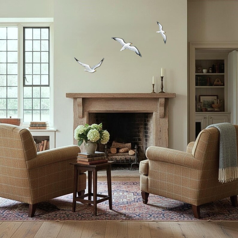 Statement coastal wall art with flock of seagulls above fireplace