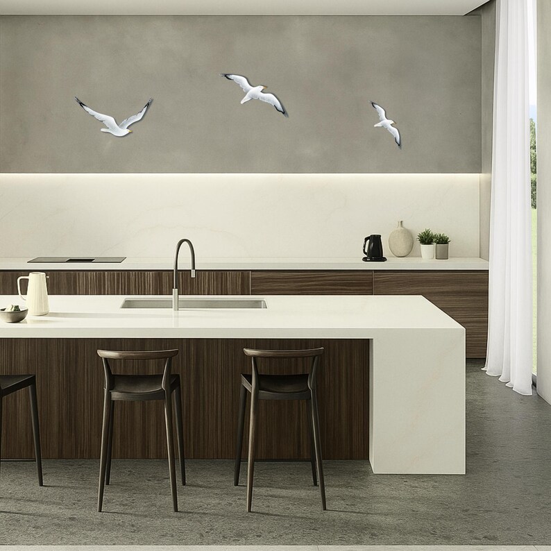 Coastal wall art installation with flock of hand painted wooden seagulls in kitchen space