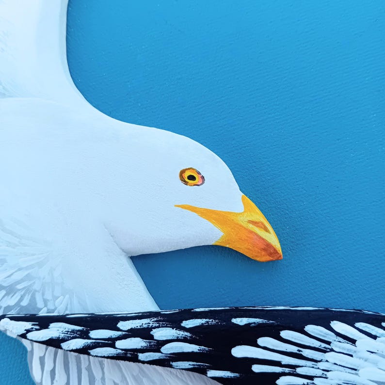 Hand painted wooden seagulls detail showing head and wing