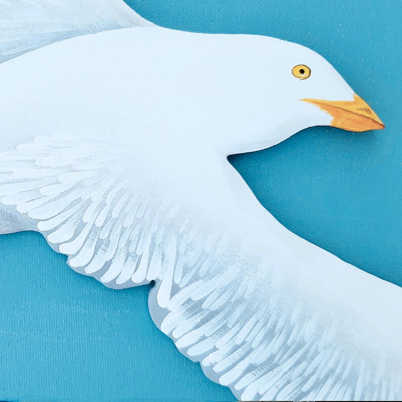 Hand painted wooden seagull sculpture detail for coastal wall art
