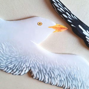 Hand painted wooden seagulls detail showing head and wing
