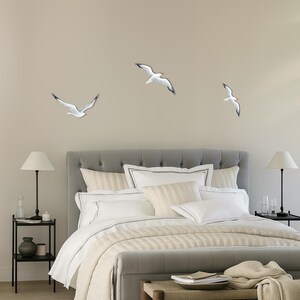 each wall art with flock of 3 seagulls as large wall installation