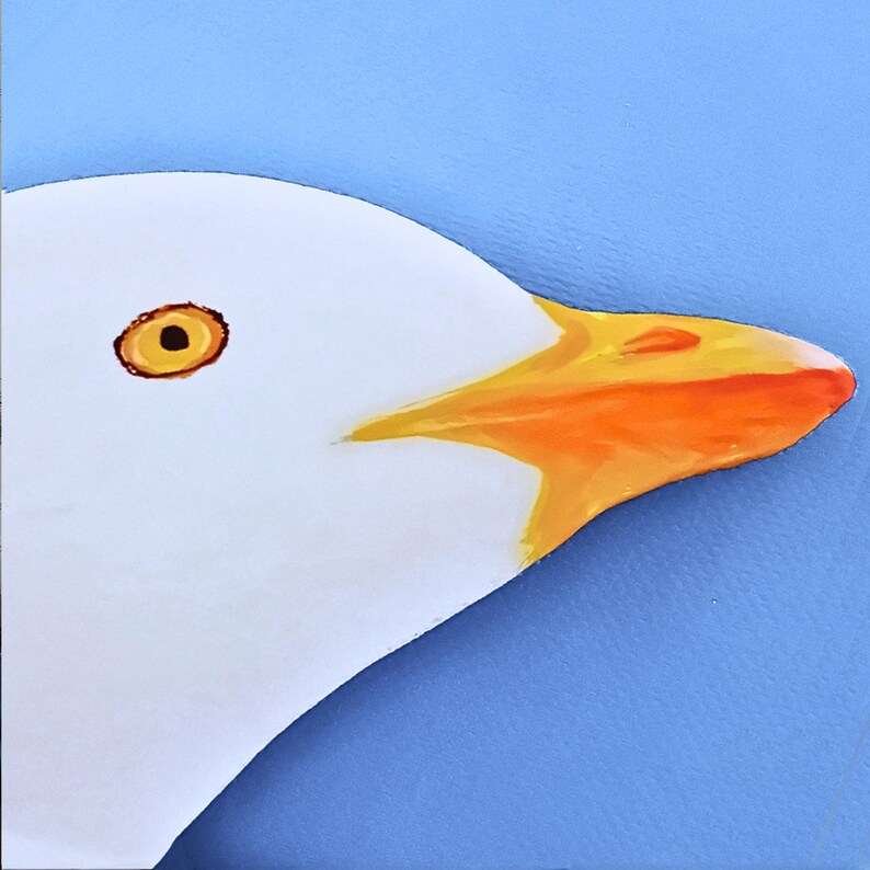 Hand carved wooden seagull head detail, coastal bird sculpture