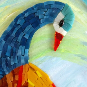 May include: Close-up of a mosaic peacock with blue, red, and yellow glass tiles. The peacock's head is turned to the side, and its eye is visible.