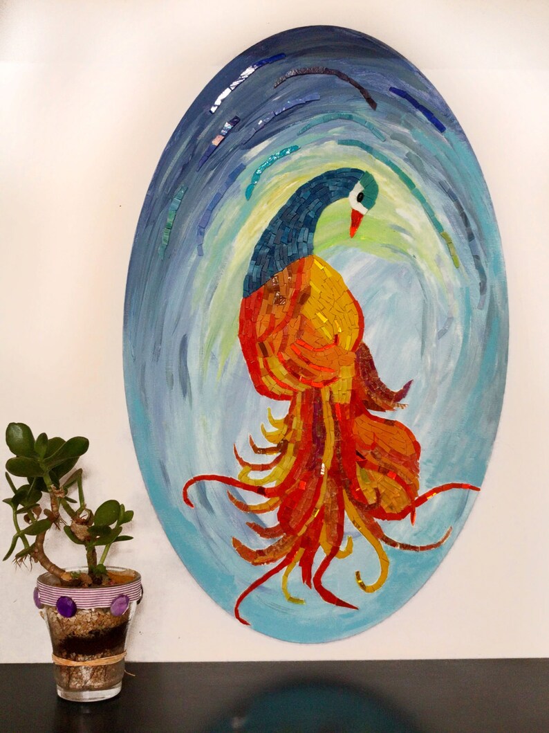 May include: A mosaic artwork depicting a colorful bird with a long, flowing tail. The bird is made of small, colorful tiles and is set against a blue and green background.