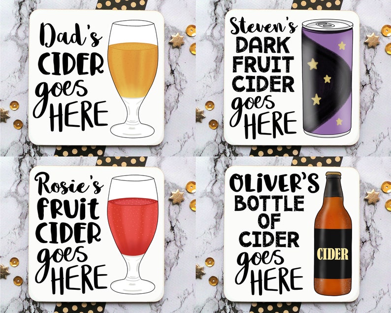 May include: Four white square coasters with black text and illustrations of different types of cider. The text on the coasters reads "Dad's Cider goes here", "Rosie's Fruit Cider goes here", "Steven's Dark Fruit Cider goes here", and "Oliver's Bottle of Cider goes here".
