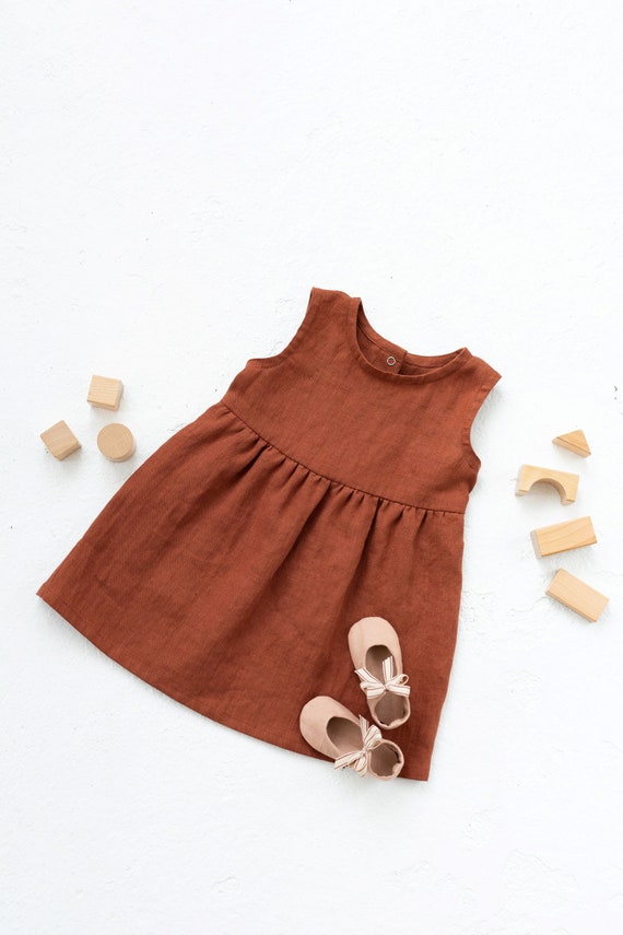 Girls linen round neck sleeveless dress in Burnt orange color. Summer boho children dresss for girls and toddlers.